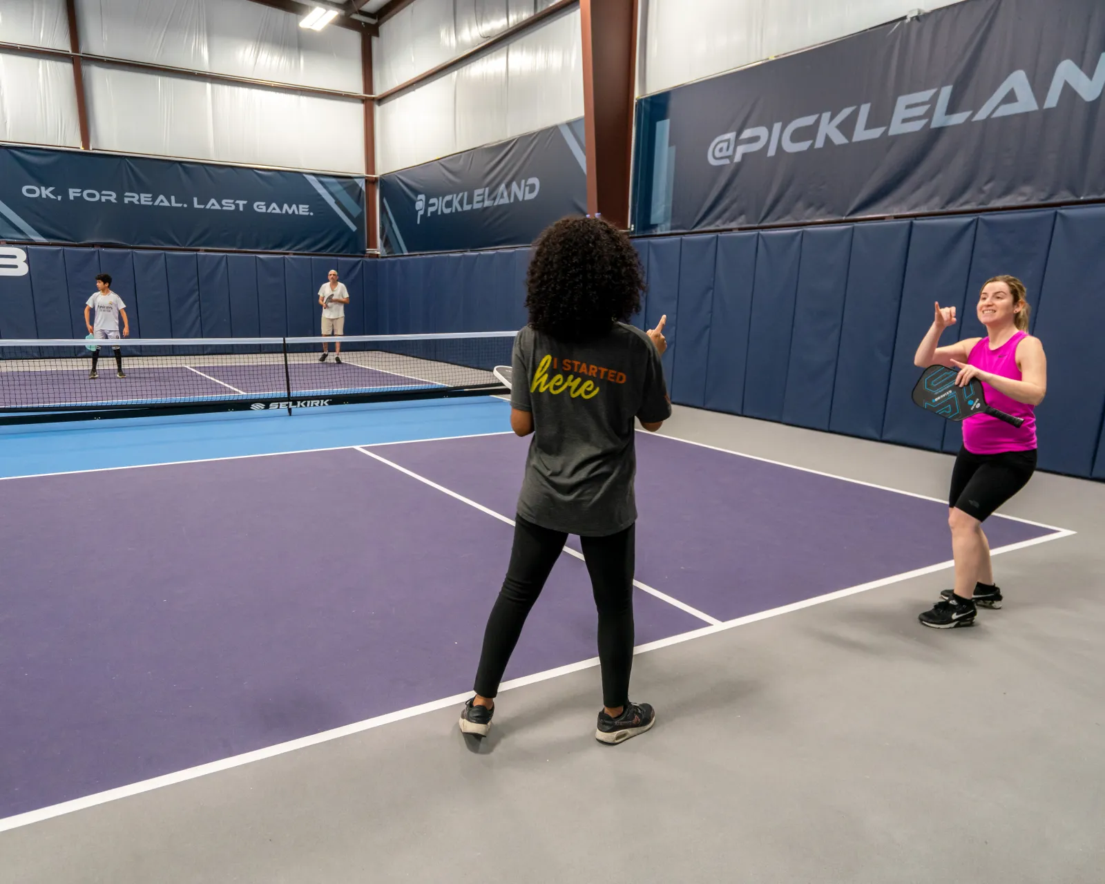 Players warming up on court at the ASL social