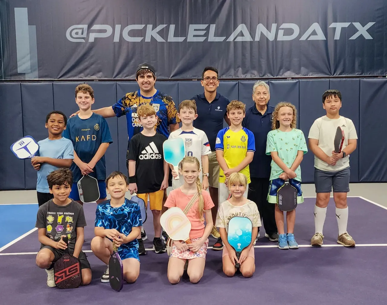 A group of kids at a junior pickleball clinic at Pickleland
