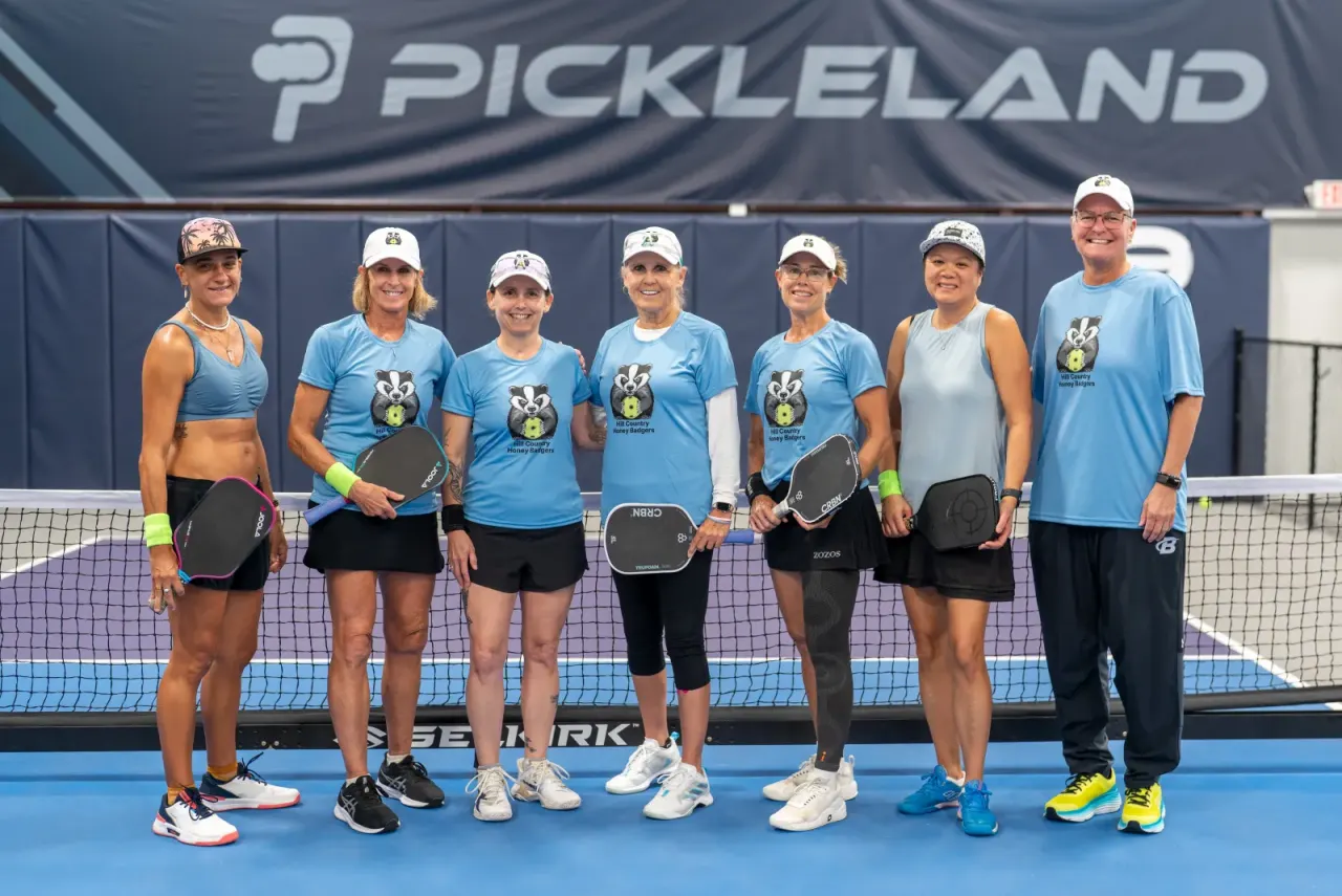 A Pickleland league team in matching shirts after a match