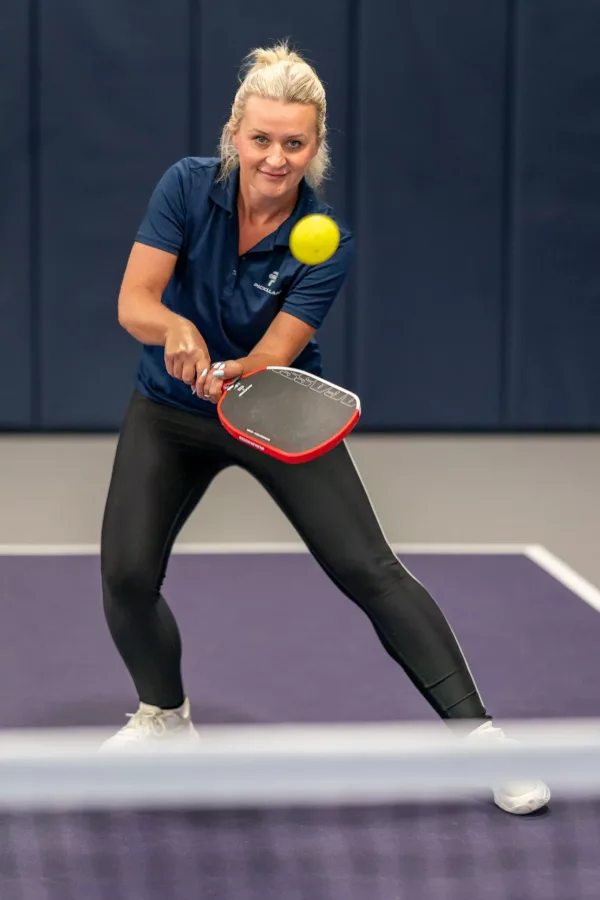 Kasia Carr, pro coach at Pickleland, lining up a backhand