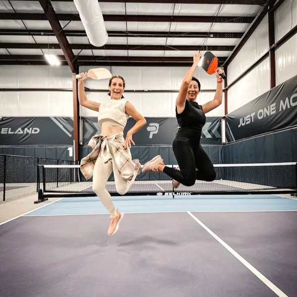 Pickleland members playing on the indoor pickleball courts in Pflugerville