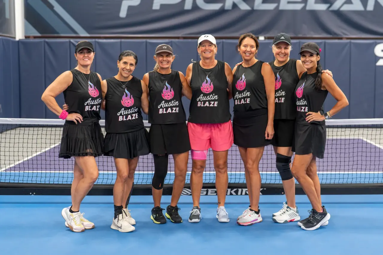 Women's league team in matching jerseys pose together