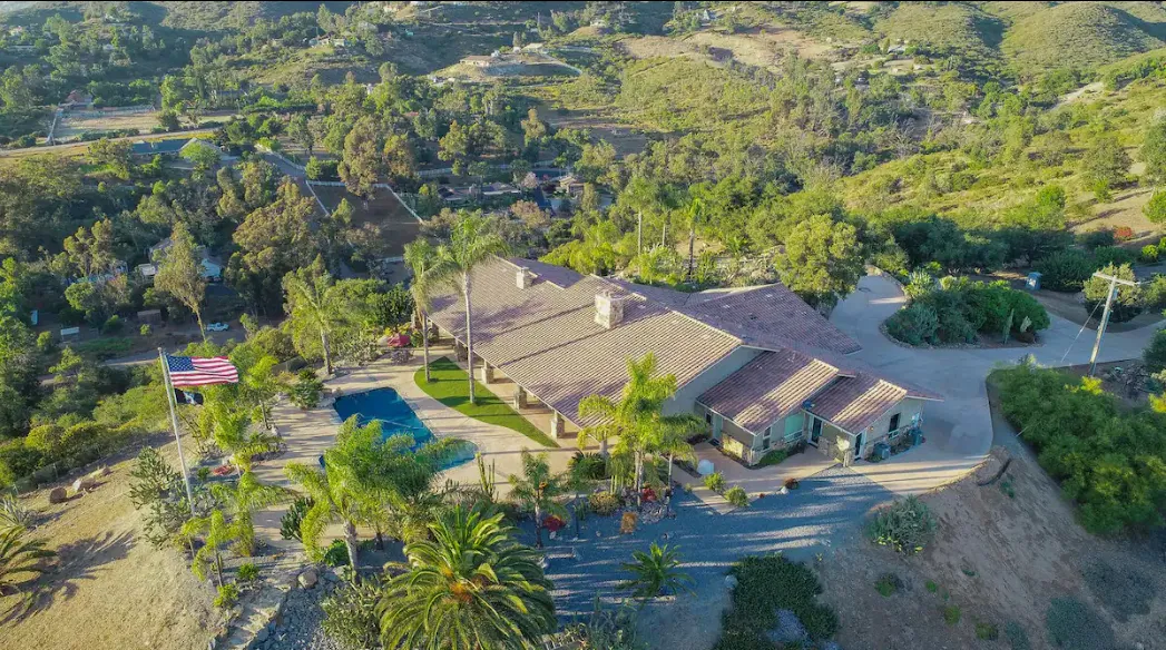 SanDiegoPoolHome resort-style backyard pickleball court on a private nine-acre Lakeside lot