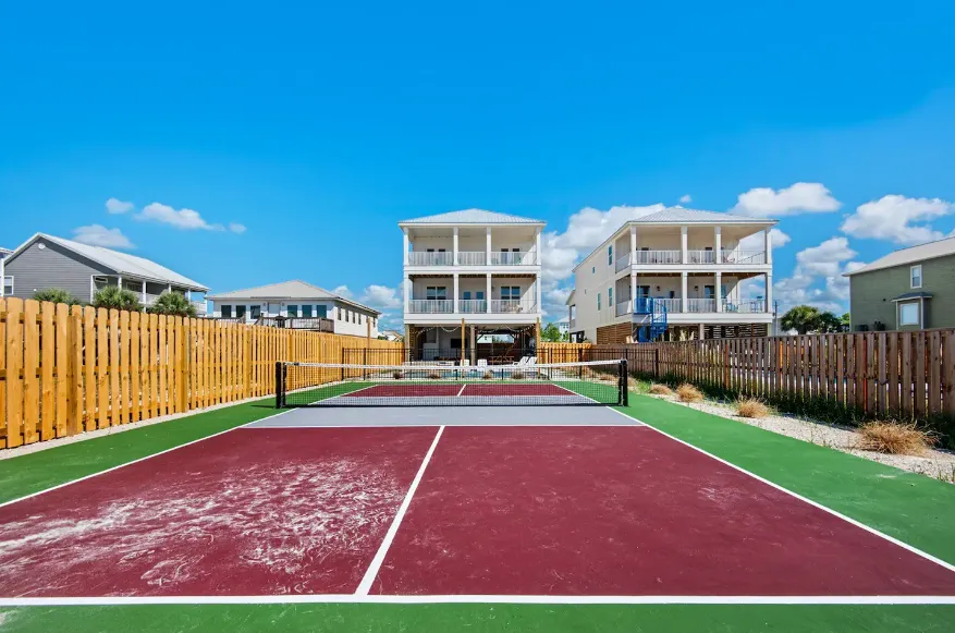 Sandy Toes Pickleball Club beachfront Gulf Shores home with a full pickleball court