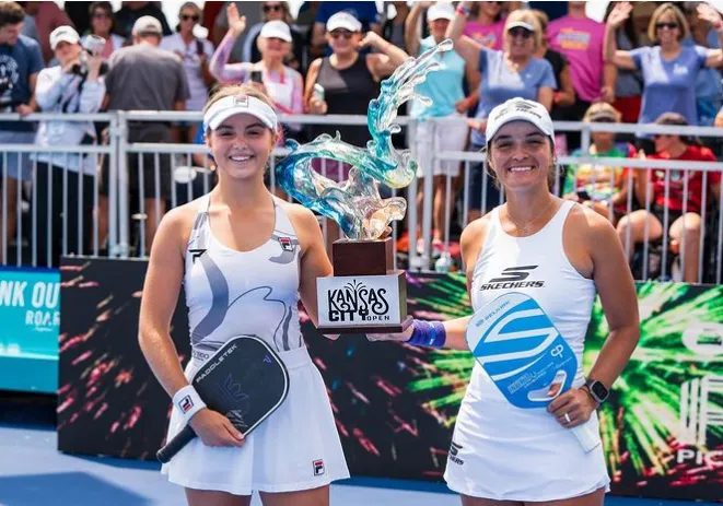 Anna Leigh Waters and her mother Leigh Waters holding trophies after a doubles win
