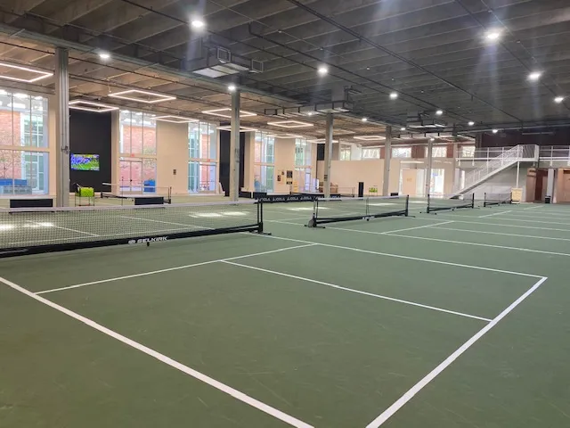 Modern indoor pickleball courts at the Eastside Paddle Club in East Austin