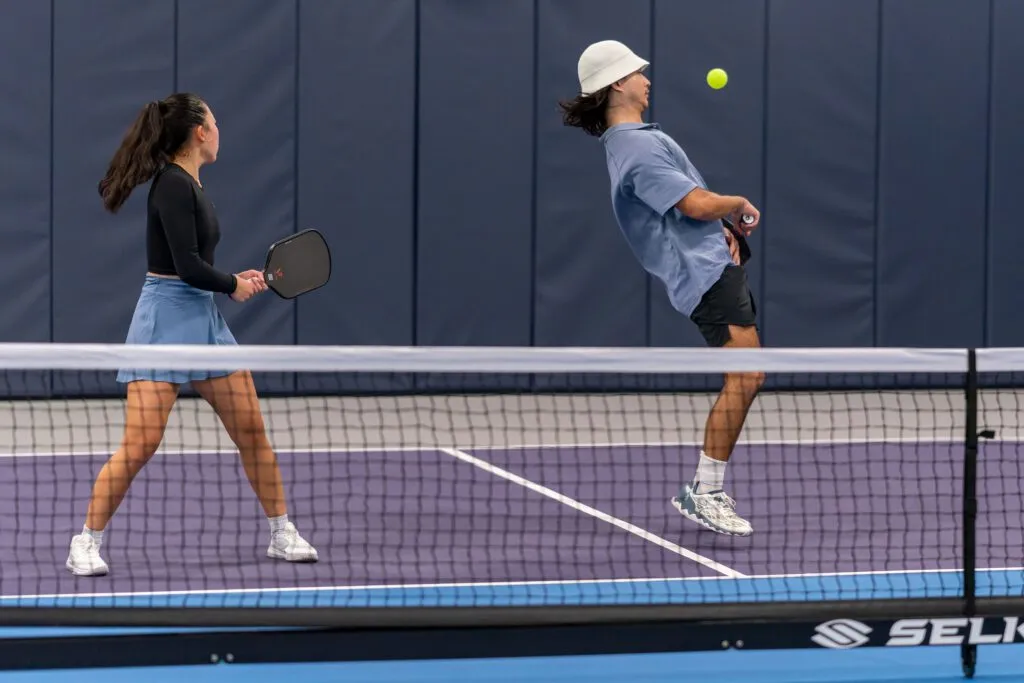 Pickleball balls on an indoor court at Pickleland