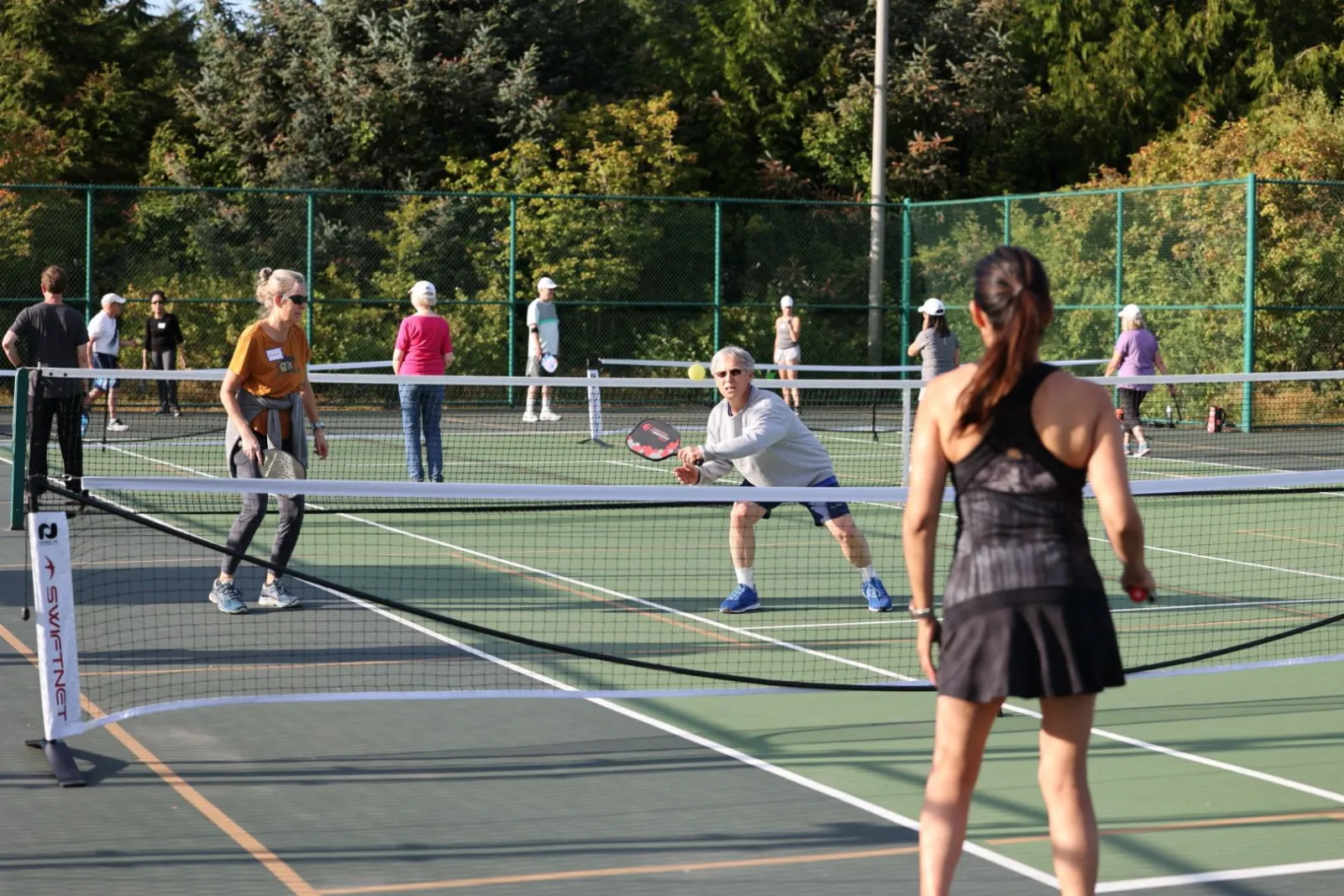 Wood-surface indoor pickleball courts at Westside Community Center and Library