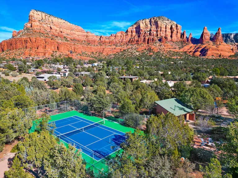 Red rock views surrounding outdoor pickleball play in Sedona, Arizona