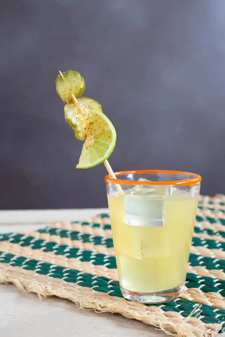 The Pickled Surfer tropical cocktail with pineapple, coconut rum, and pickle juice