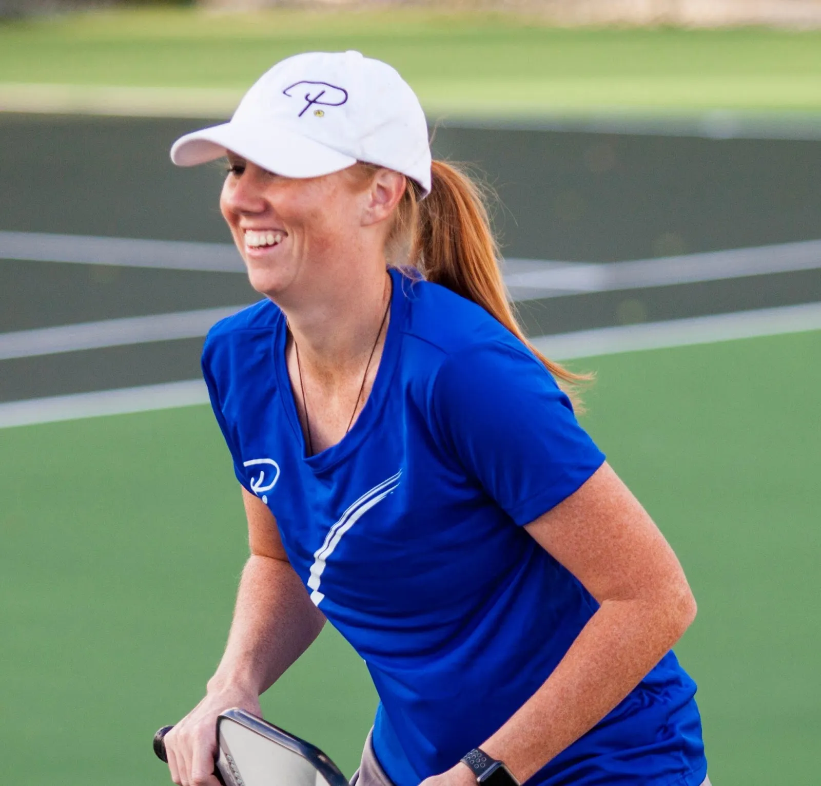 Michele Stroyek smiling on the pickleball court