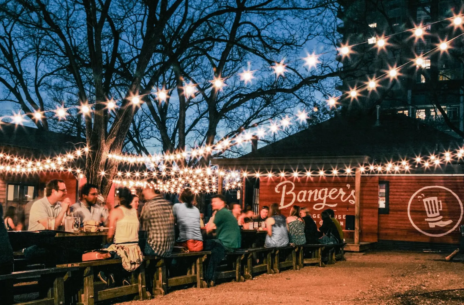 Bars, restaurants, and food carts along Rainey Street in Austin at night