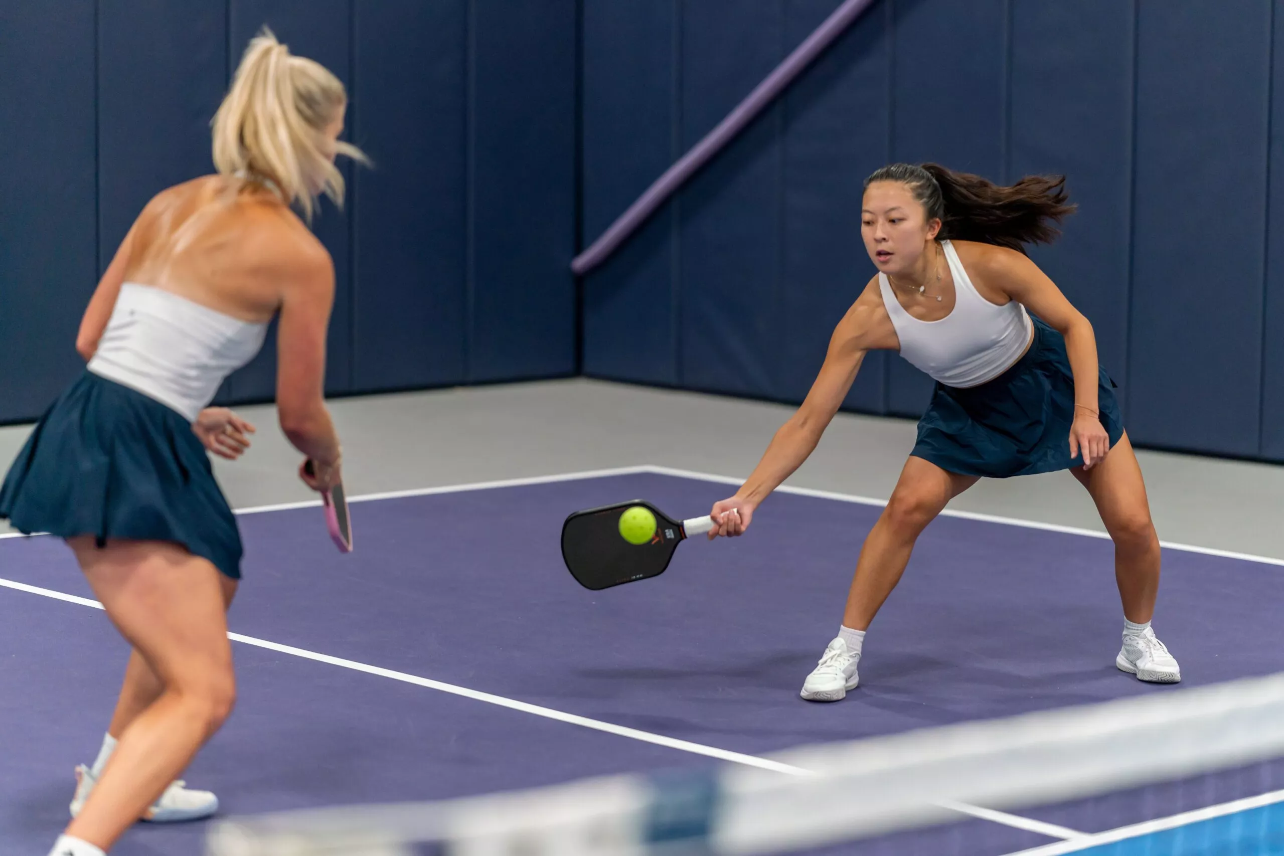 2 girls playing pickleball in Austin